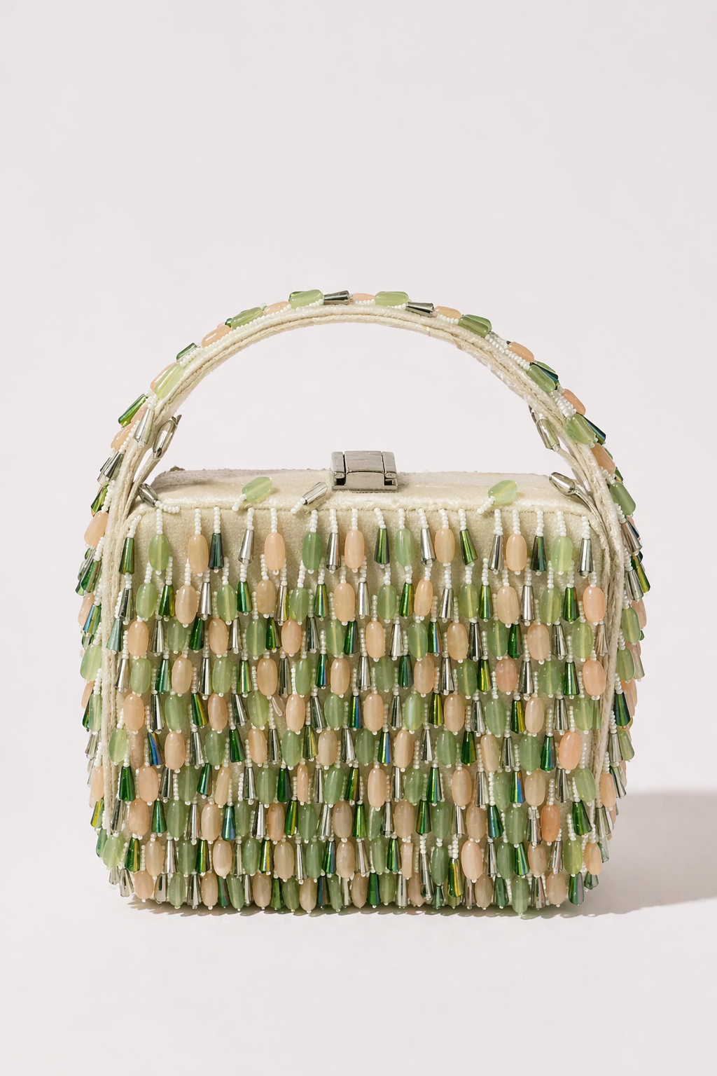 Green beaded box handbag with layered embellishments and handcrafted festive detailing