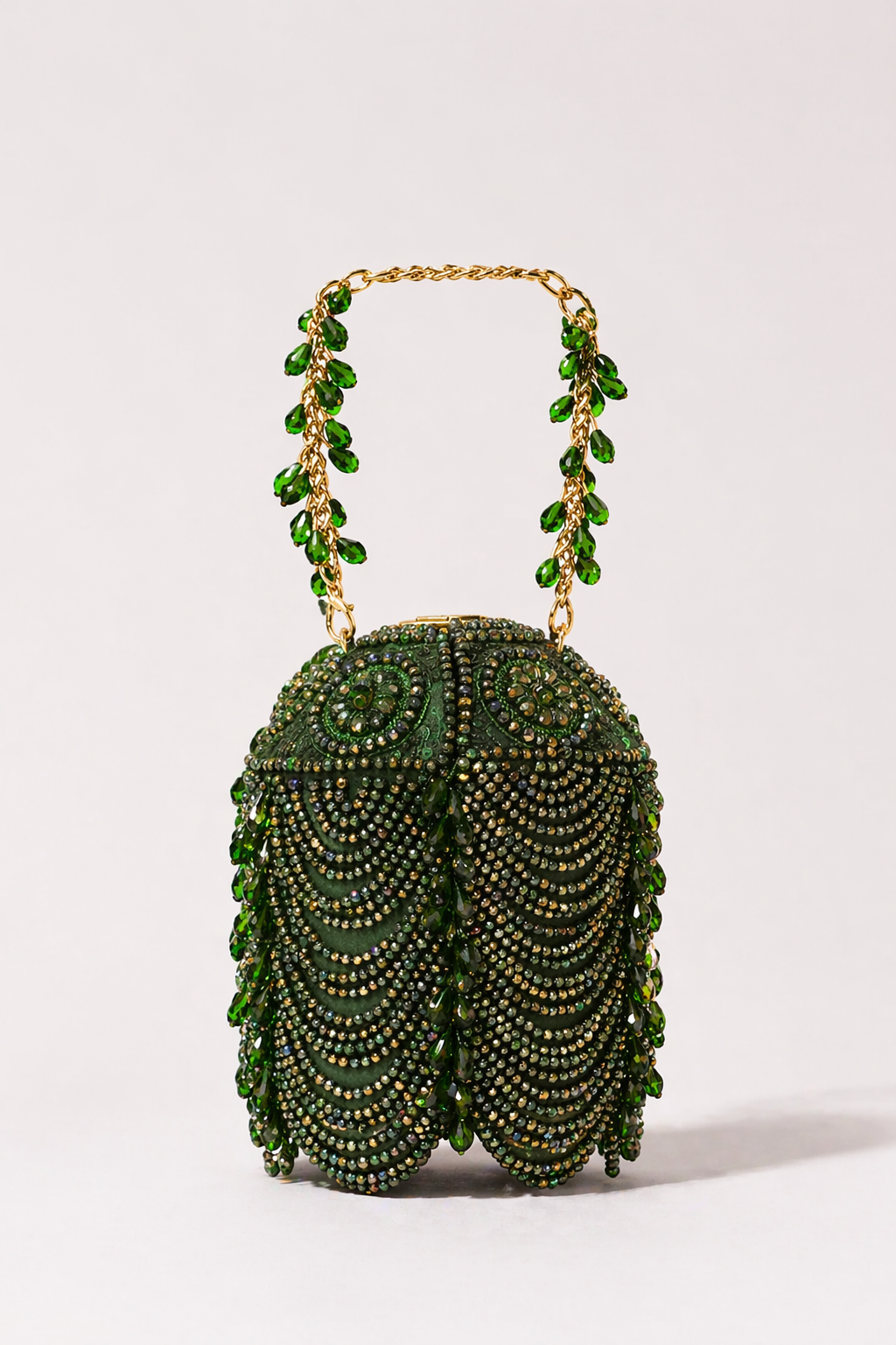 Green beaded handbag with layered embellishments and festive handcrafted detailing