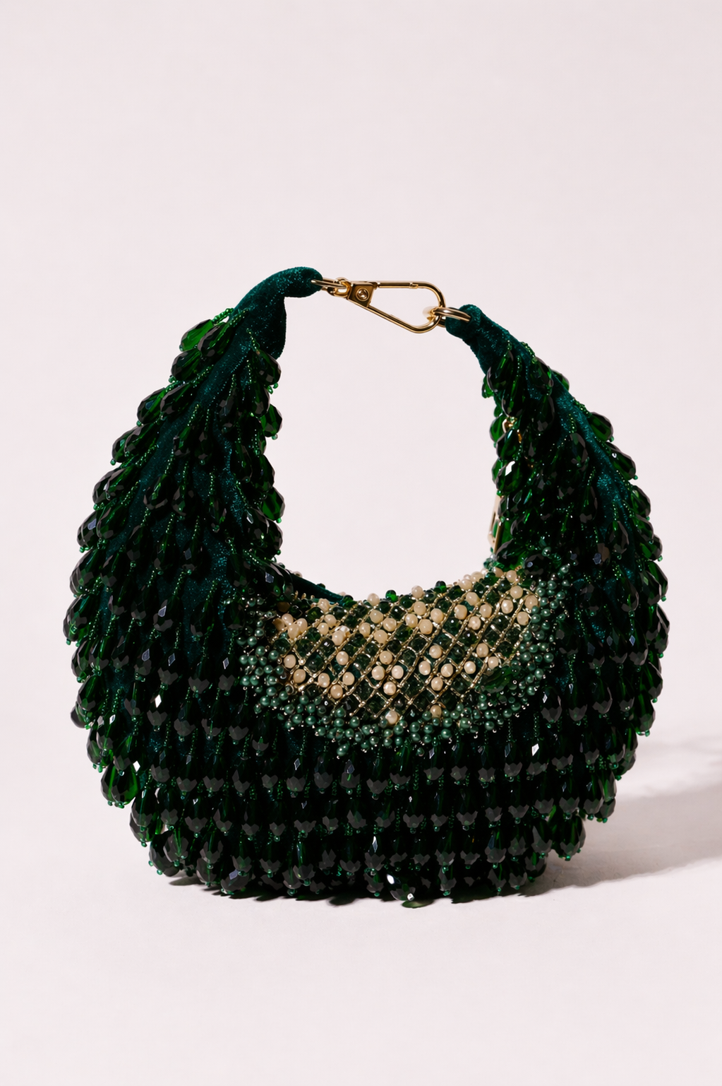 Emerald crystal hobo bag with layered embellishments and rich jewel-toned detailing