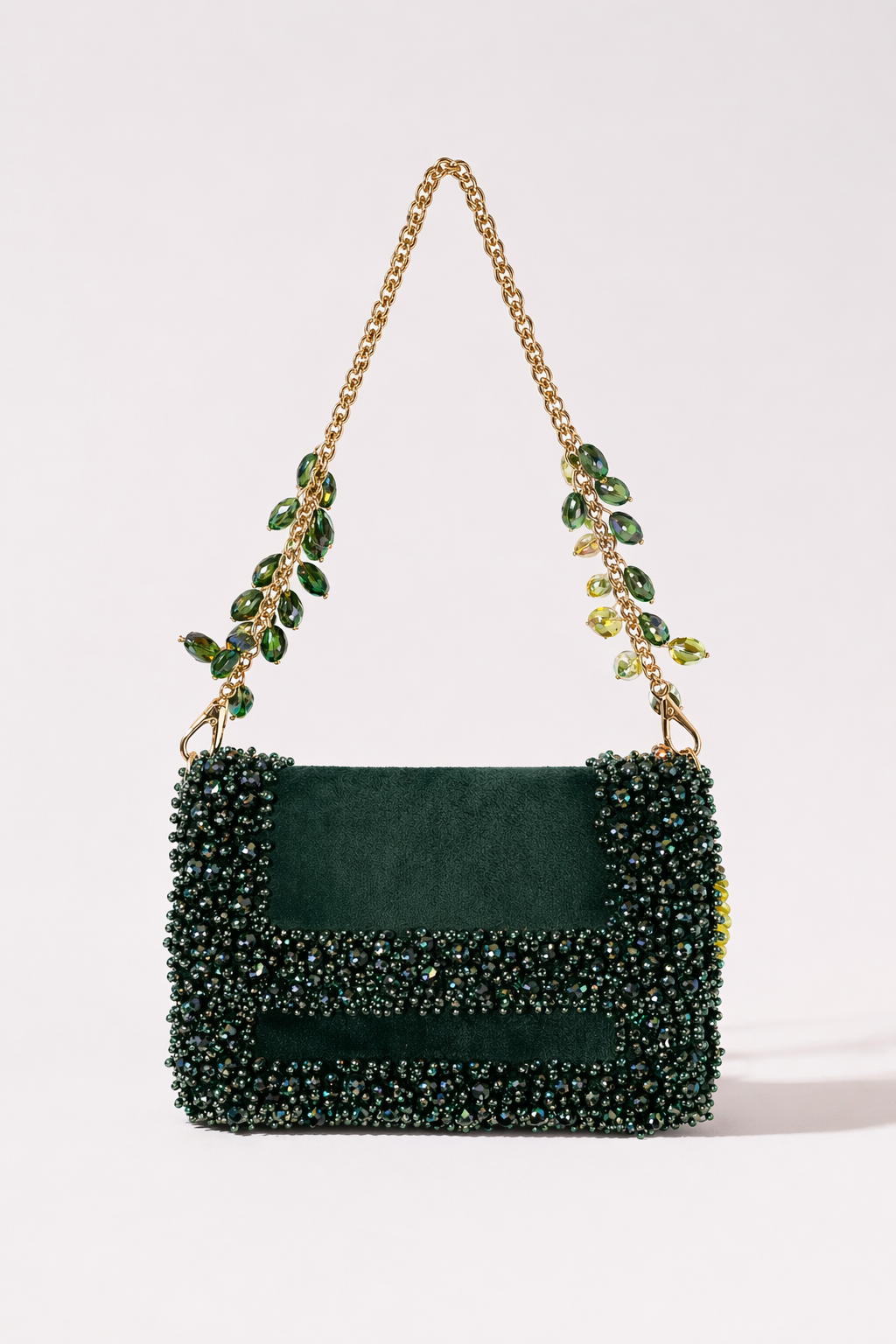 Green crystal shoulder bag with statement embellishments and elegant chain detailing