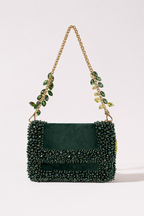 Green crystal shoulder bag with statement embellishments and elegant chain detailing