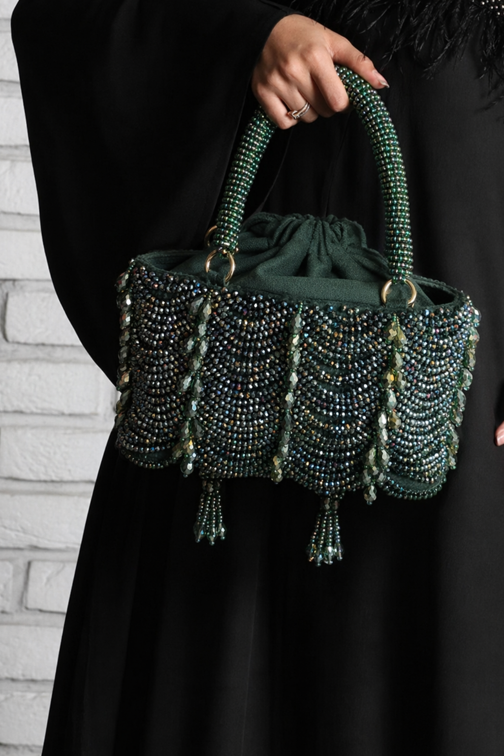 Green festive drawstring handbag designed beautifully for receptions and occasion dressing