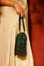 Handcrafted green shoulder bag designed for festive celebrations and cocktail evenings