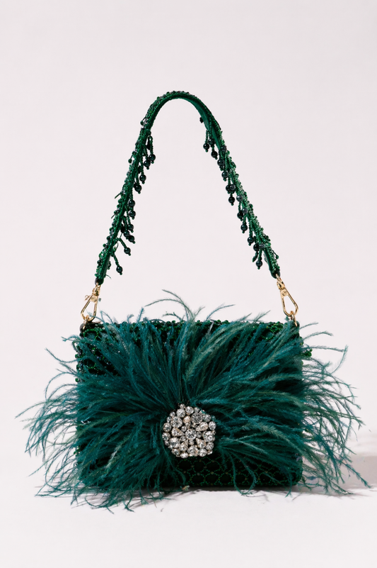 Green feather handbag with sparkling crystal embellishments and bold couture-inspired texture