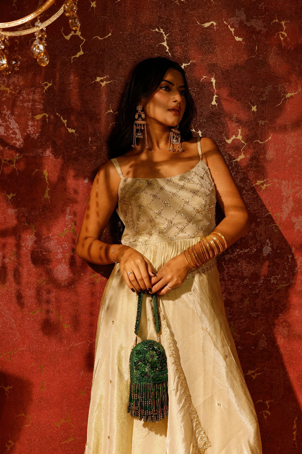 Festive green accessory with handcrafted embroidery and shimmering bead craftsmanship