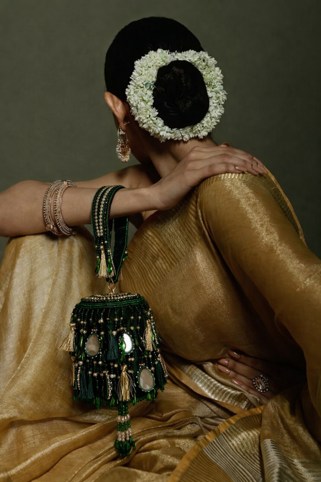 Green festive party purse featuring mirror embellishments and statement handcrafted detailing