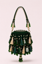 Green mirror work mini bag with elegant tassel detailing and handcrafted festive texture