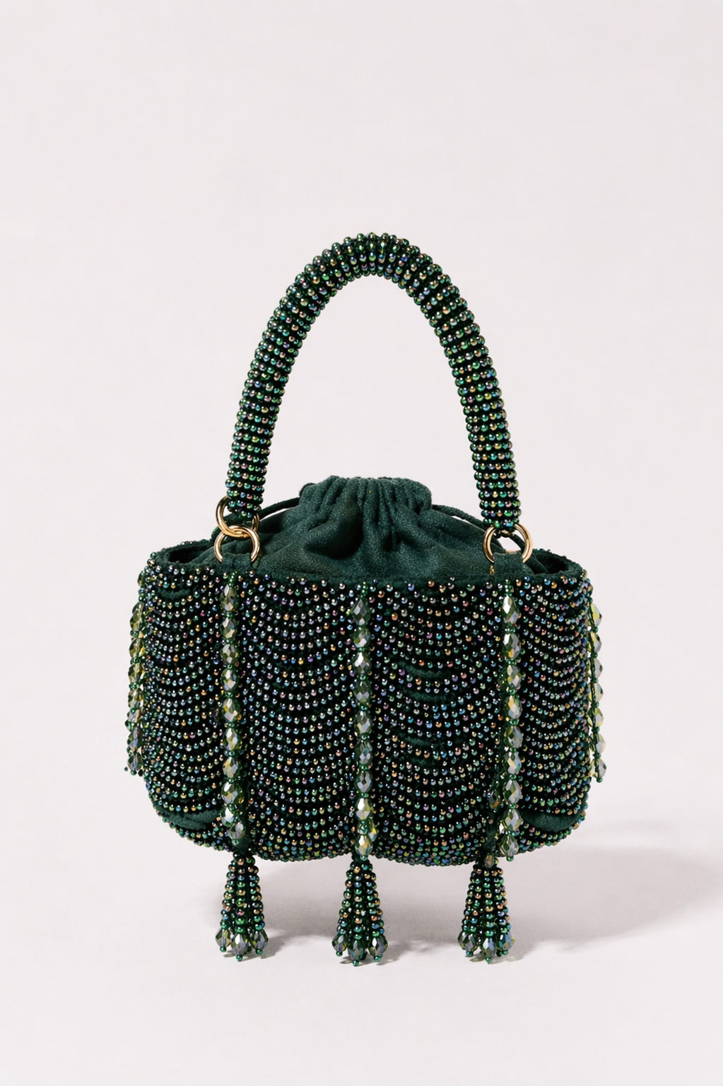 Green beaded party handbag with layered embellishments and elegant festive detailing
