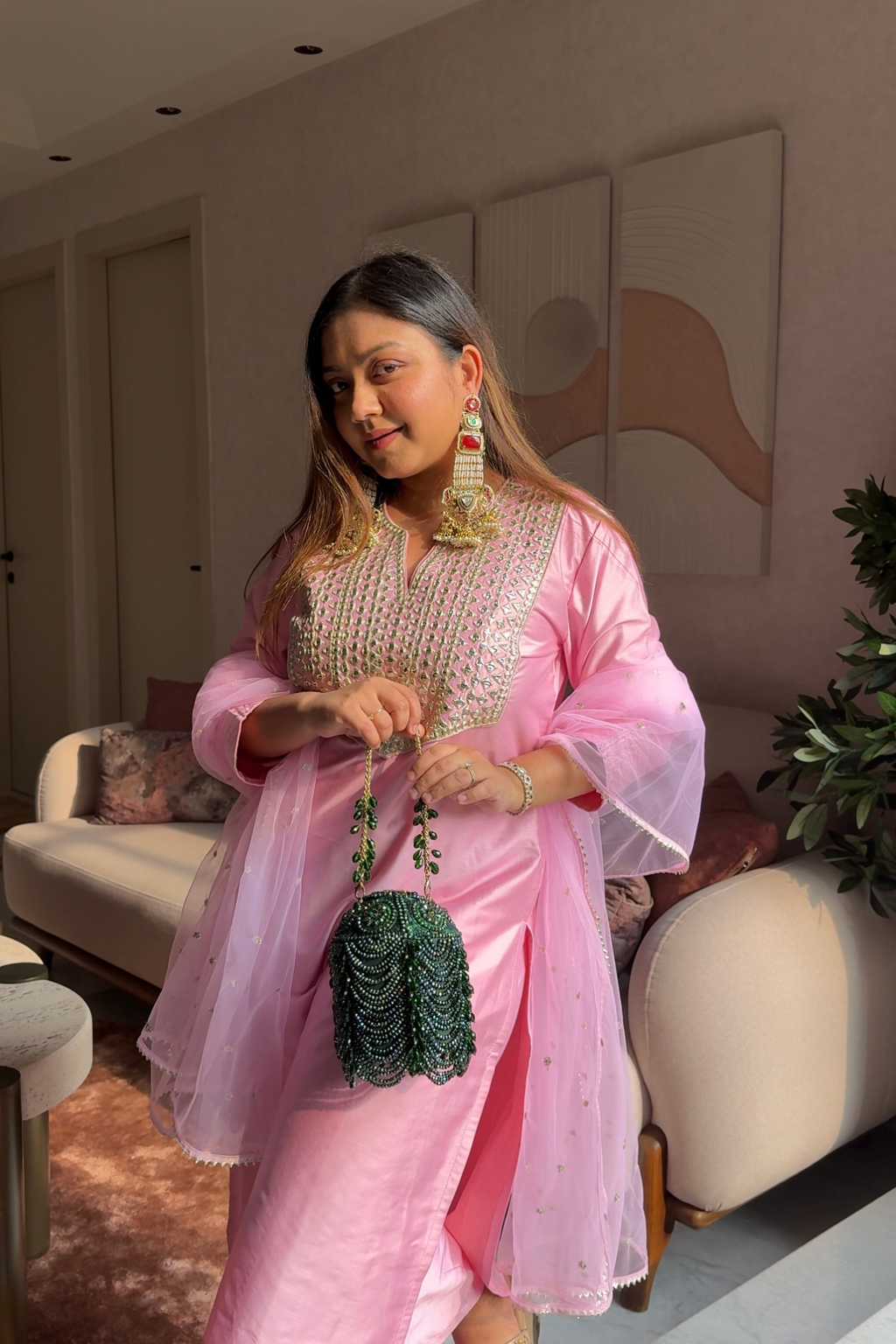 Green wedding guest handbag featuring intricate stone embellishments and luxe craftsmanship