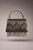 Gunmetal fringe evening purse featuring statement embellishments and sophisticated sparkle