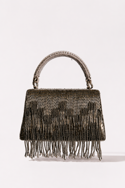 Gunmetal trousseau clutch with shimmering fringe detailing and elegant handcrafted texture
