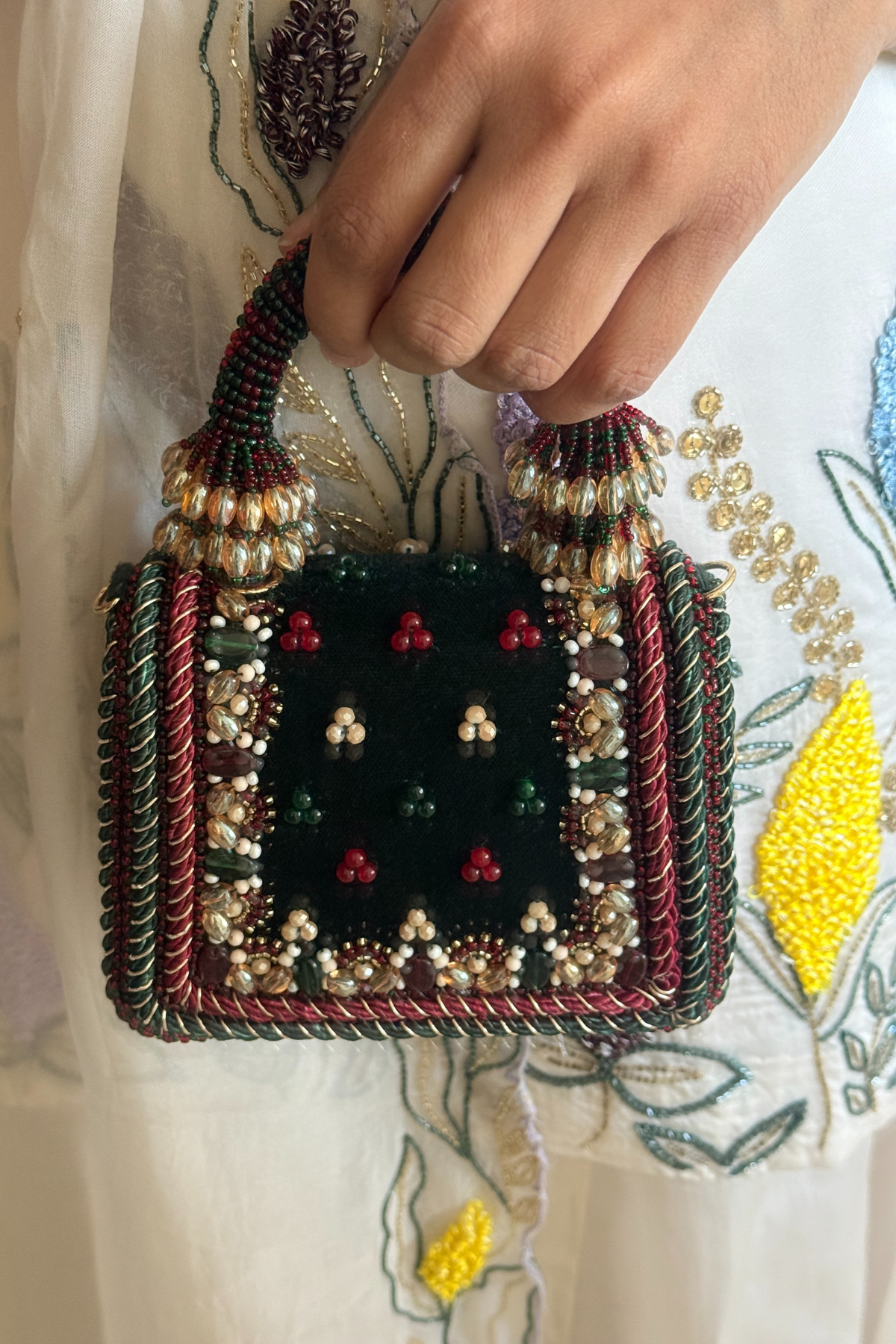Handcrafted statement party bag combining artisanal craftsmanship with luxe festive glamour