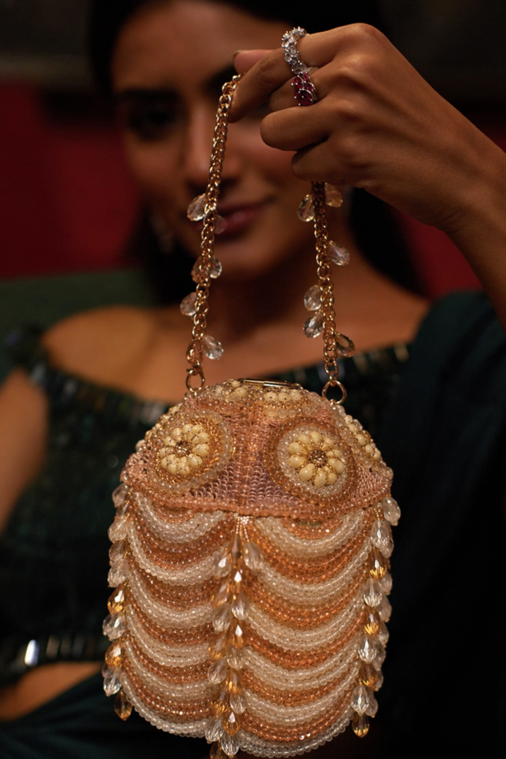 Peach occasion bag with layered pearl embellishments and crystal accents