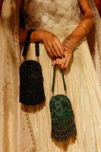 Statement black occasion bag featuring textured beadwork and cascading fringe
