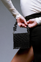 Handcrafted black festive purse combining artisanal craftsmanship with modern evening glamour