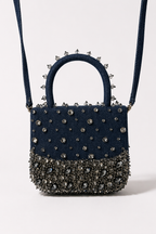 Handcrafted blue party handbag combining modern denim texture