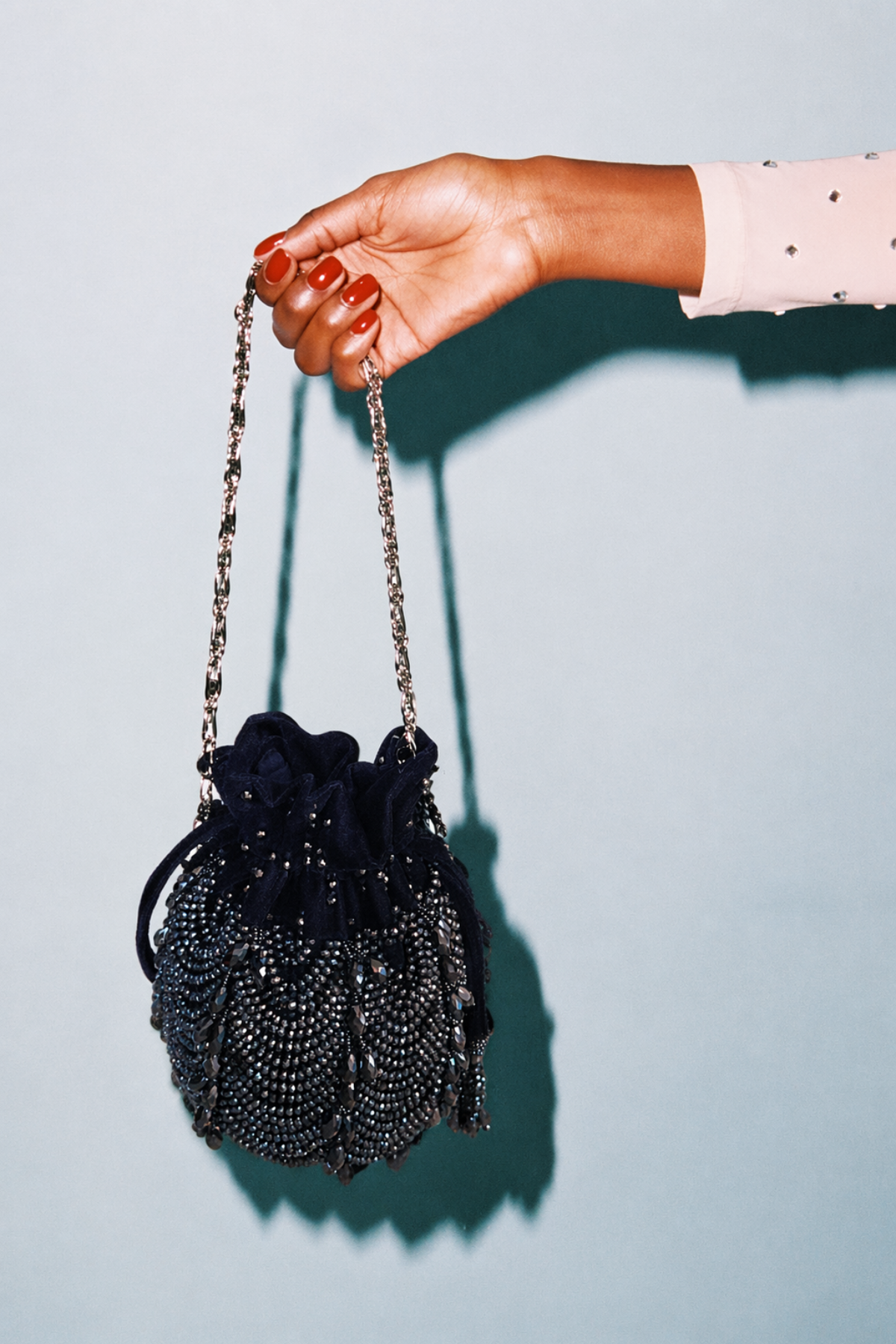 Handcrafted charcoal blue party purse combining rich texture with modern evening glamour