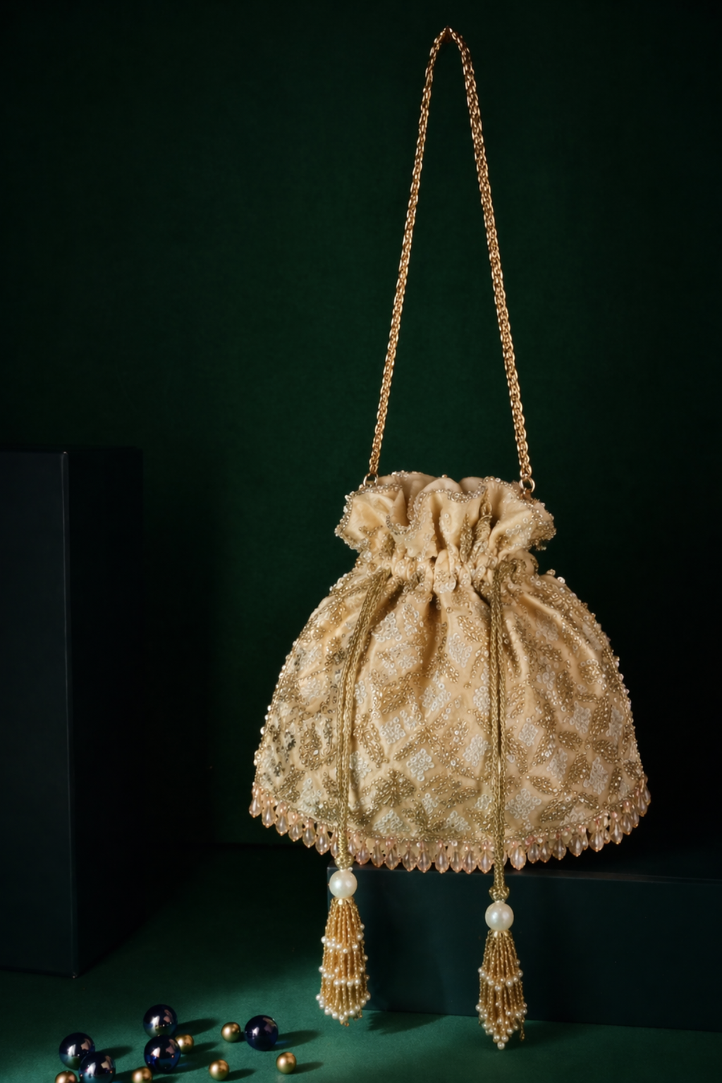 Handcrafted trousseau bag combining luxurious texture with elegant celebration styling