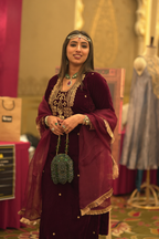 Handcrafted dark green celebration purse styled perfectly for festive dressing