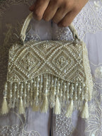 Handcrafted pearl festive bag combining artisanal craftsmanship with timeless elegance