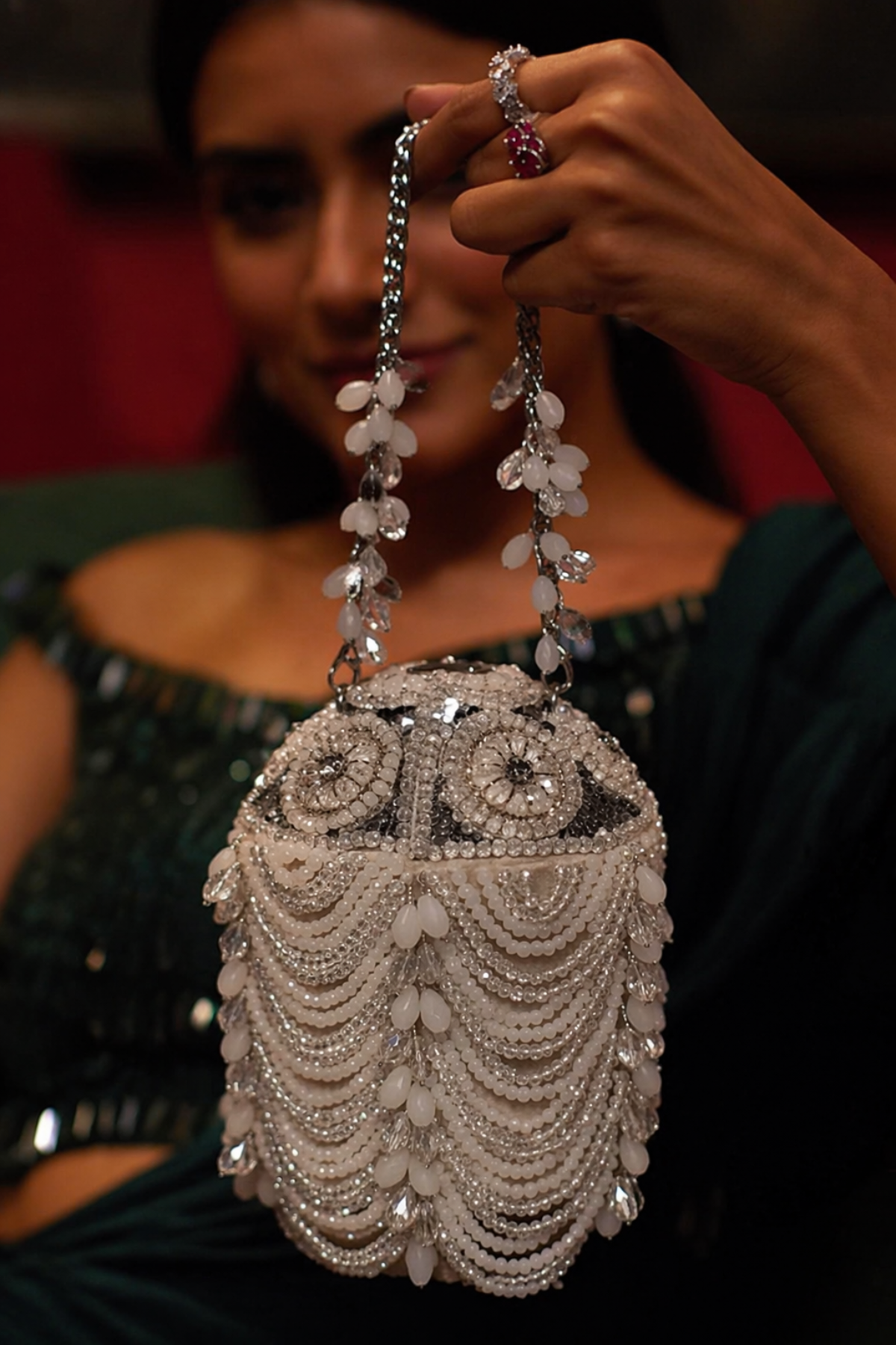 Pearl potli bag with layered embellishments and crystal accents