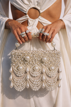 Handcrafted pearl statement purse combining couture-inspired detailing with modern elegance