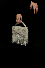 Handcrafted pearl statement purse combining artisanal craftsmanship with luxe elegance