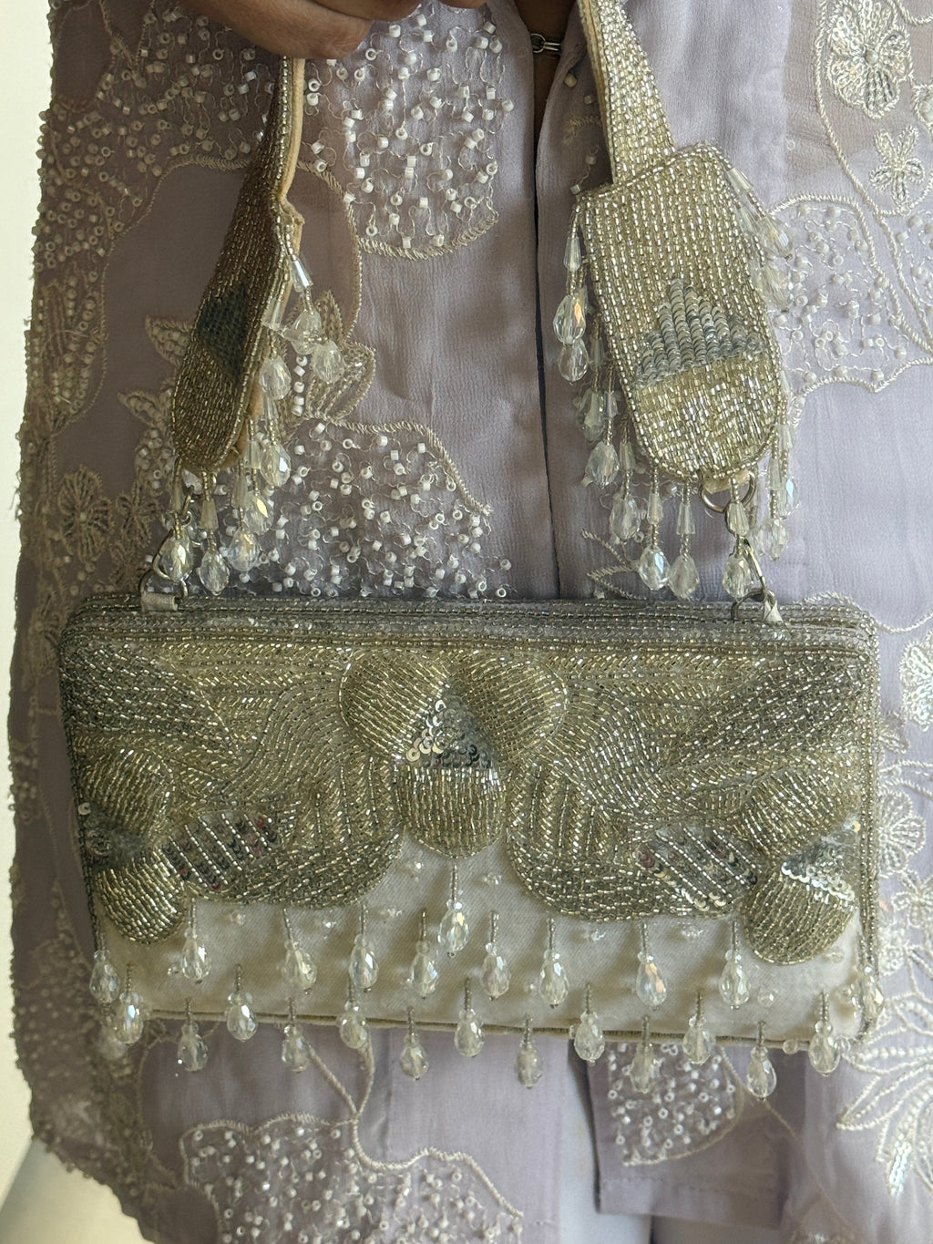 Handcrafted silver festive purse with statement crystal detailing and luxe texture