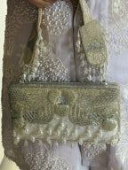 Handcrafted silver festive purse with statement crystal detailing and luxe texture