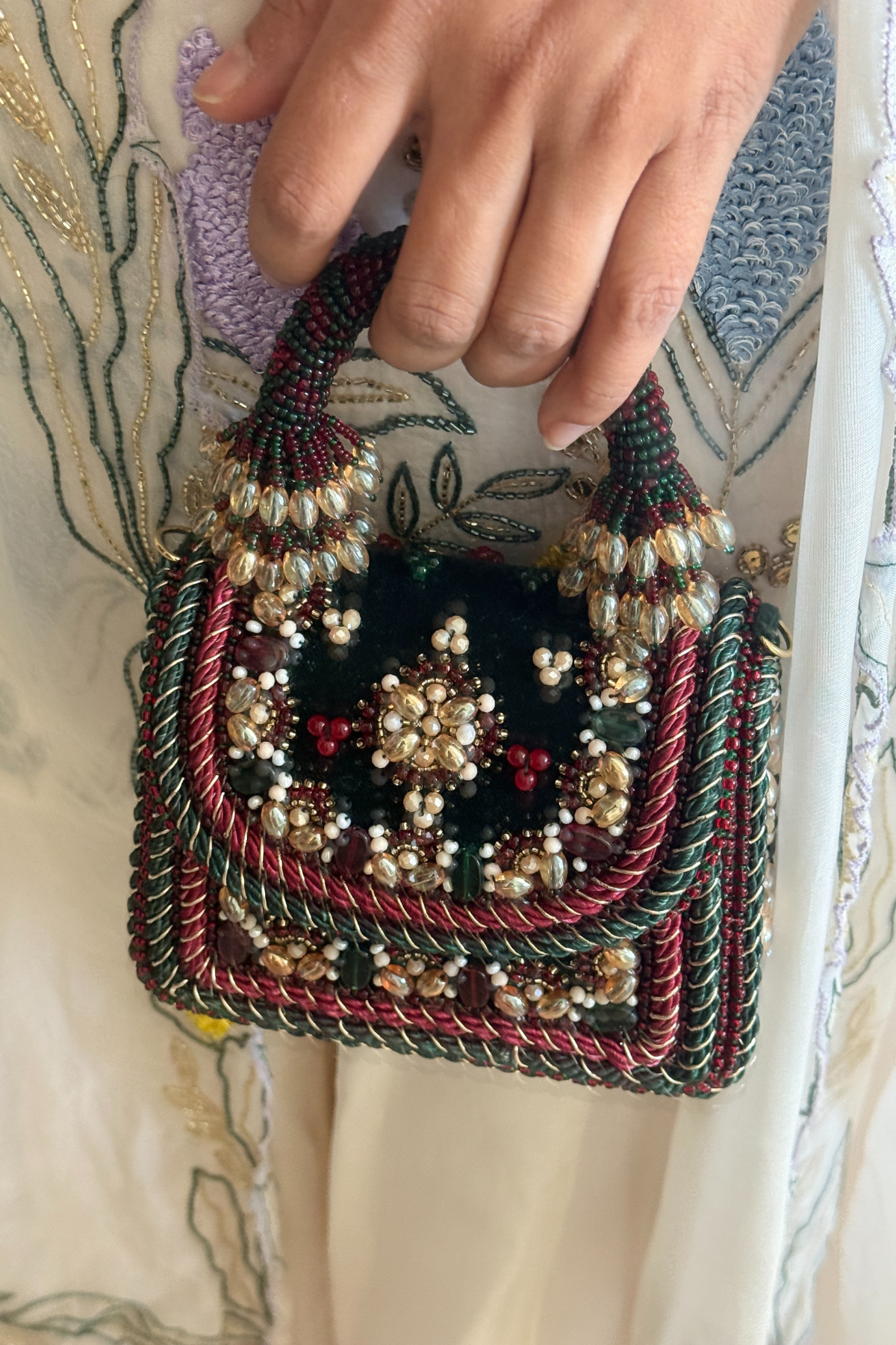 Handcrafted statement party bag combining artisanal craftsmanship with luxe festive glamour