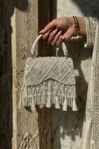 Ivory beaded evening purse inspired by glamorous celebrations and festive styling