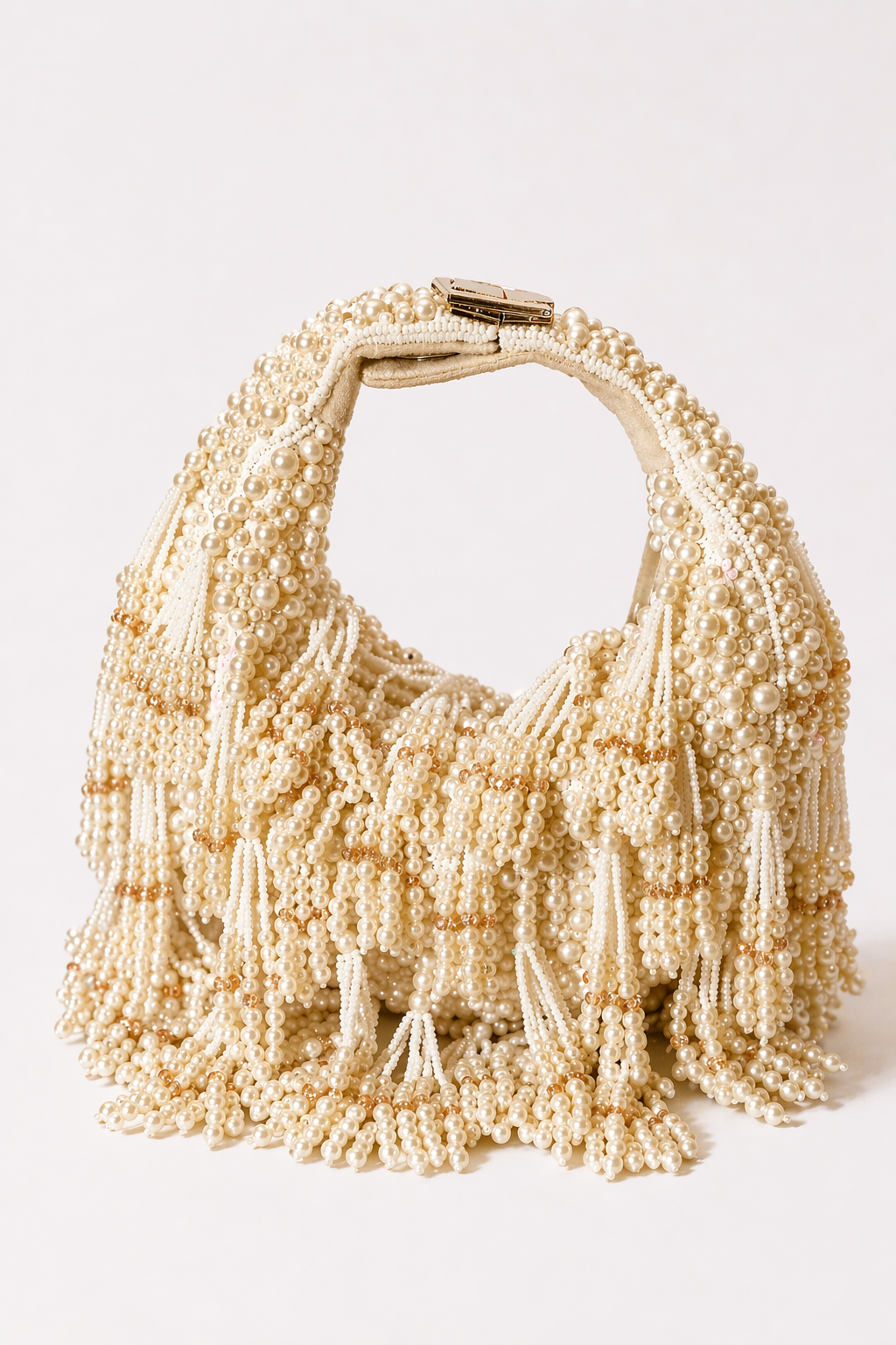 Ivory beaded handbag with cascading pearl tassels and handcrafted festive detailing