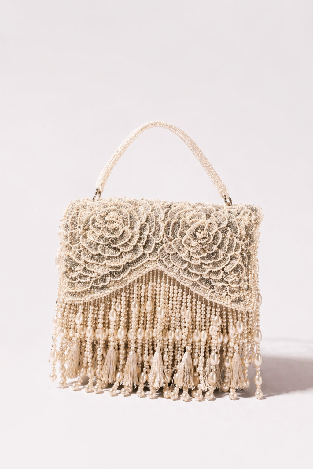 Ivory beaded party handbag inspired by glamorous celebrations and festive evening styling
