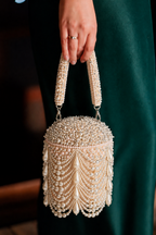 Ivory wedding guest handbag inspired by luxury bridal and festive celebration styling