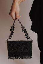 Luxury black wedding guest handbag featuring handcrafted embellishments and elegant sparkle