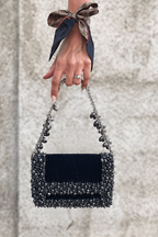 Luxury charcoal blue wedding guest purse featuring handcrafted stone embellishments and rich texture
