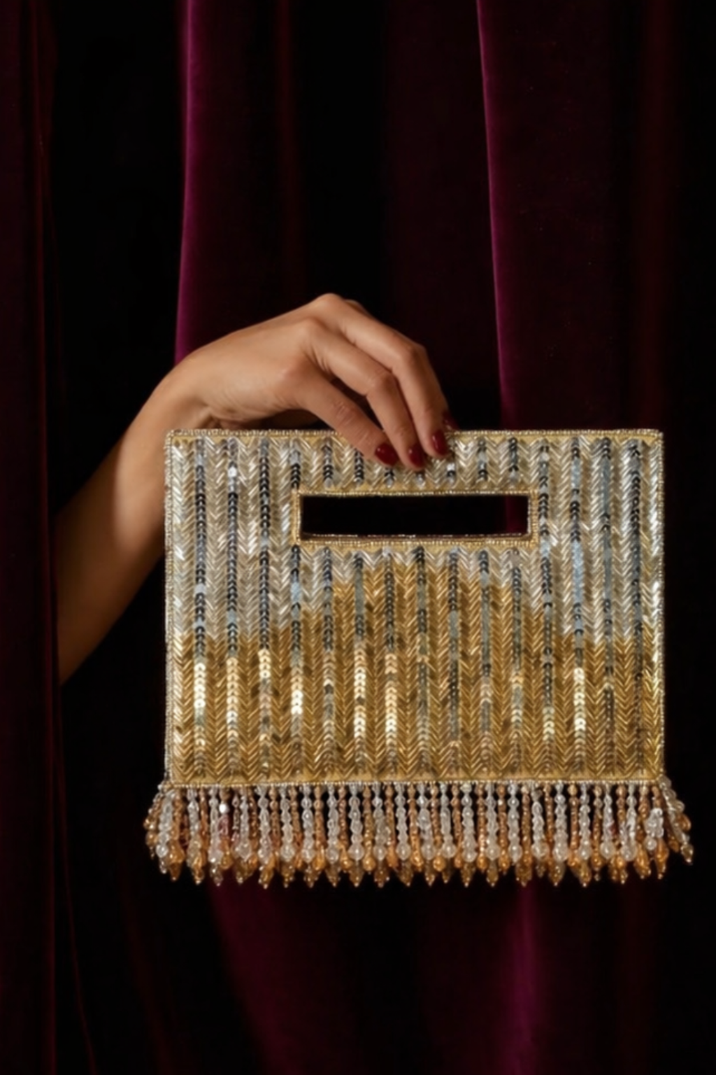 Gold beaded party handbag featuring statement fringe accents and elegant sparkle