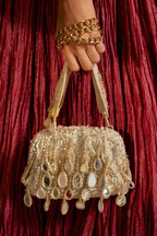 Gold beaded occasion bag featuring reflective mirror accents and artisanal craftsmanship