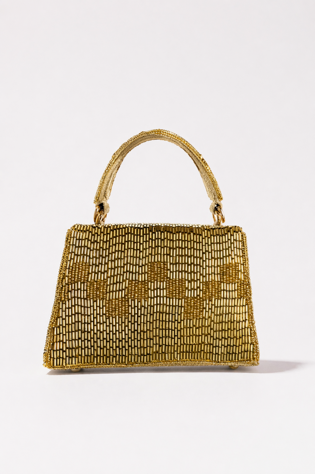 Luxury gold sling bag inspired by glamorous celebrations and festive evening styling