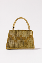 Luxury gold sling bag inspired by glamorous celebrations and festive evening styling