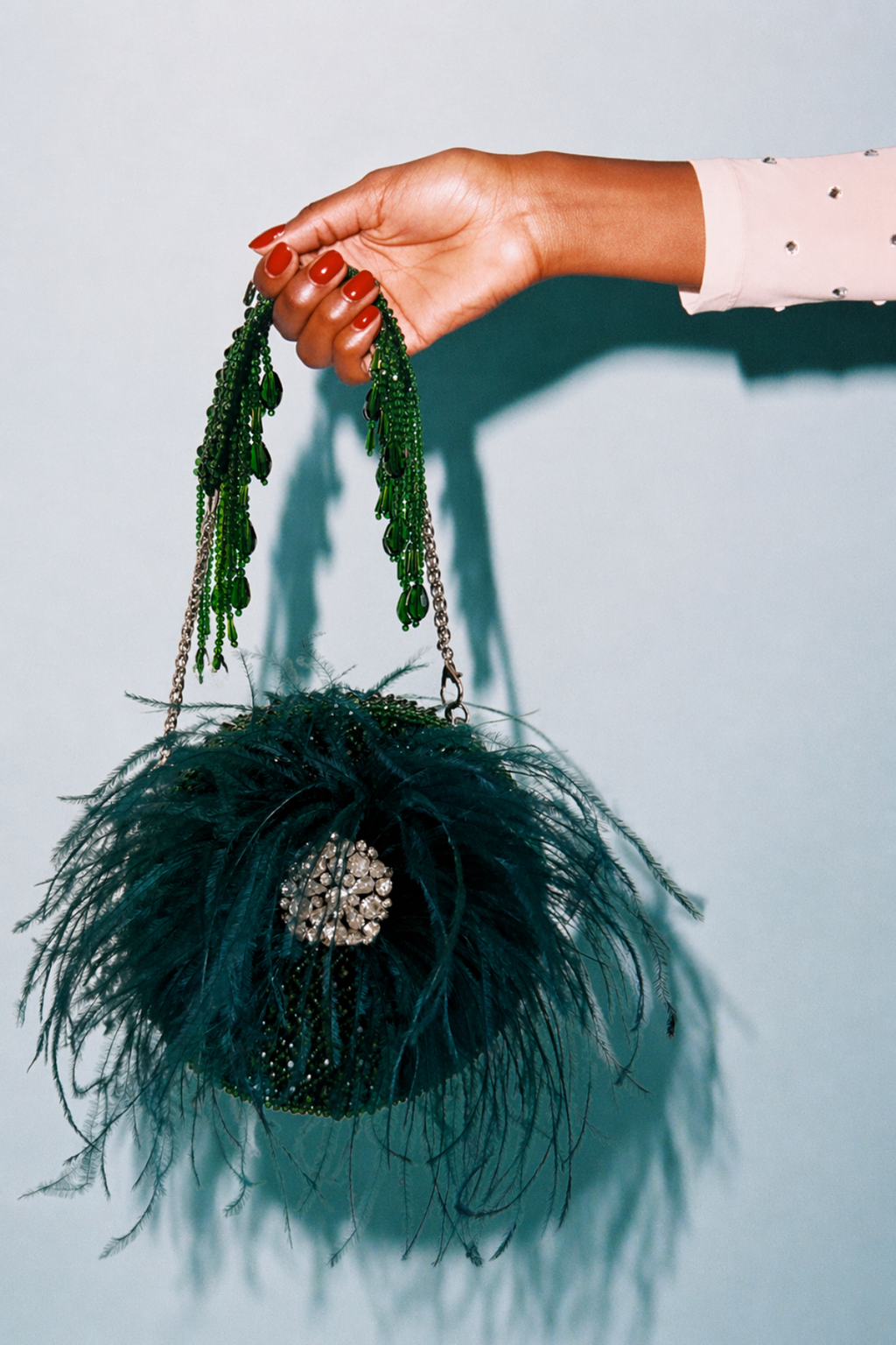 Luxury green feather purse featuring handcrafted detailing and statement party appeal