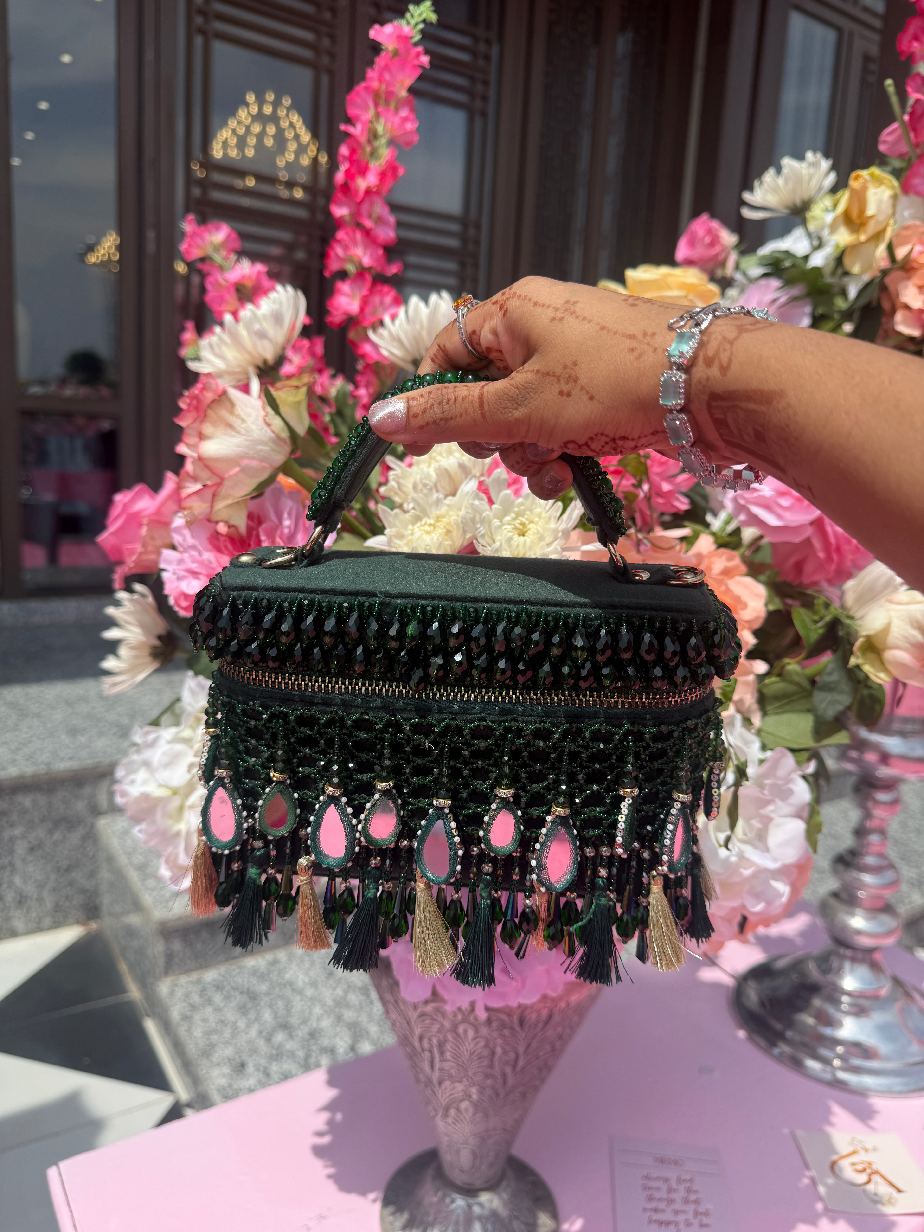 Luxury green mirror work purse featuring handcrafted beadwork and statement detailing