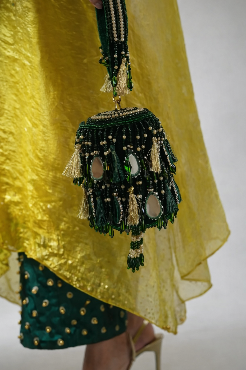 Luxury green tassel handbag inspired by glamorous celebrations and traditional styling