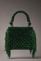 Luxury green trousseau bag featuring embellished craftsmanship and statement festive styling