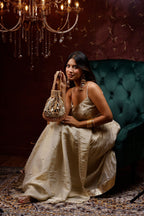 Gold festive handbag with statement mirror accents and elegant bead tassels
