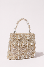 Luxury pearl holiday purse inspired by glamorous vacations and festive celebrations
