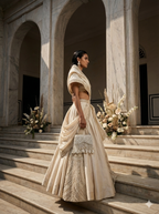 Luxury pearl wedding guest bag featuring handcrafted embellishments and layered fringe