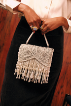 Luxury pearl wedding guest purse featuring cascading fringe and intricate embellishments
