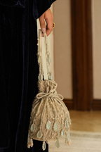 Silver beaded drawstring bag featuring reflective mirror accents and artisanal craftsmanship