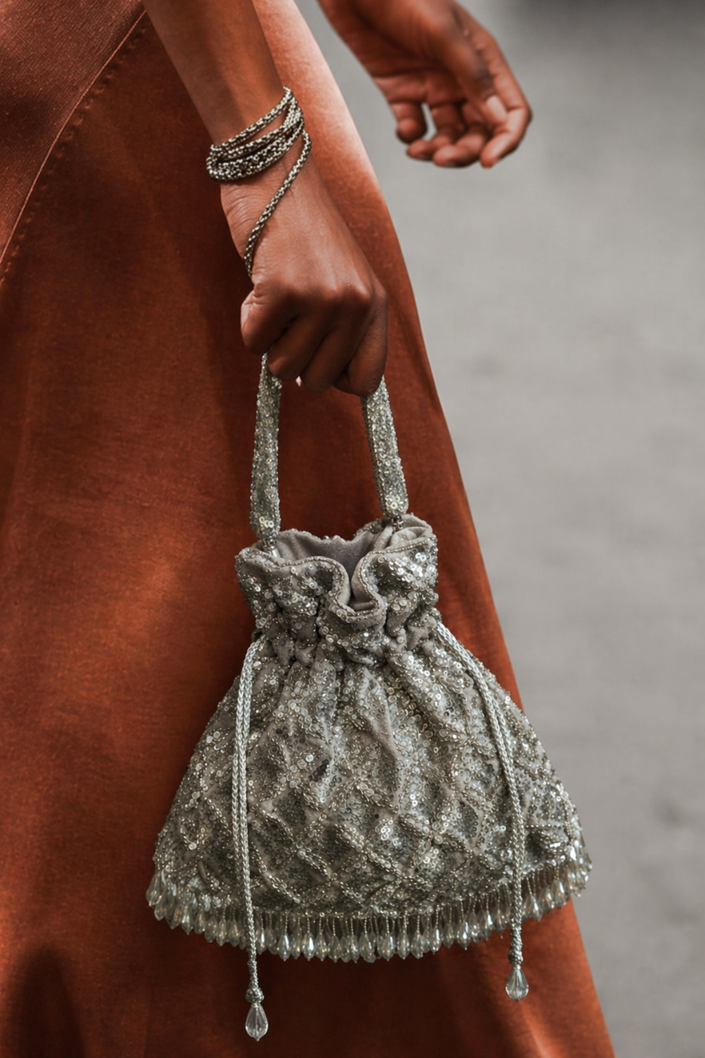 Luxury silver wedding guest purse featuring statement tassels and artisanal embellishments